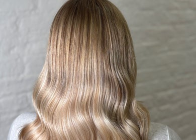 Stylish wavy blonde hair at Molly May Extensions Hair Salon in Gainsborough, England, GB.