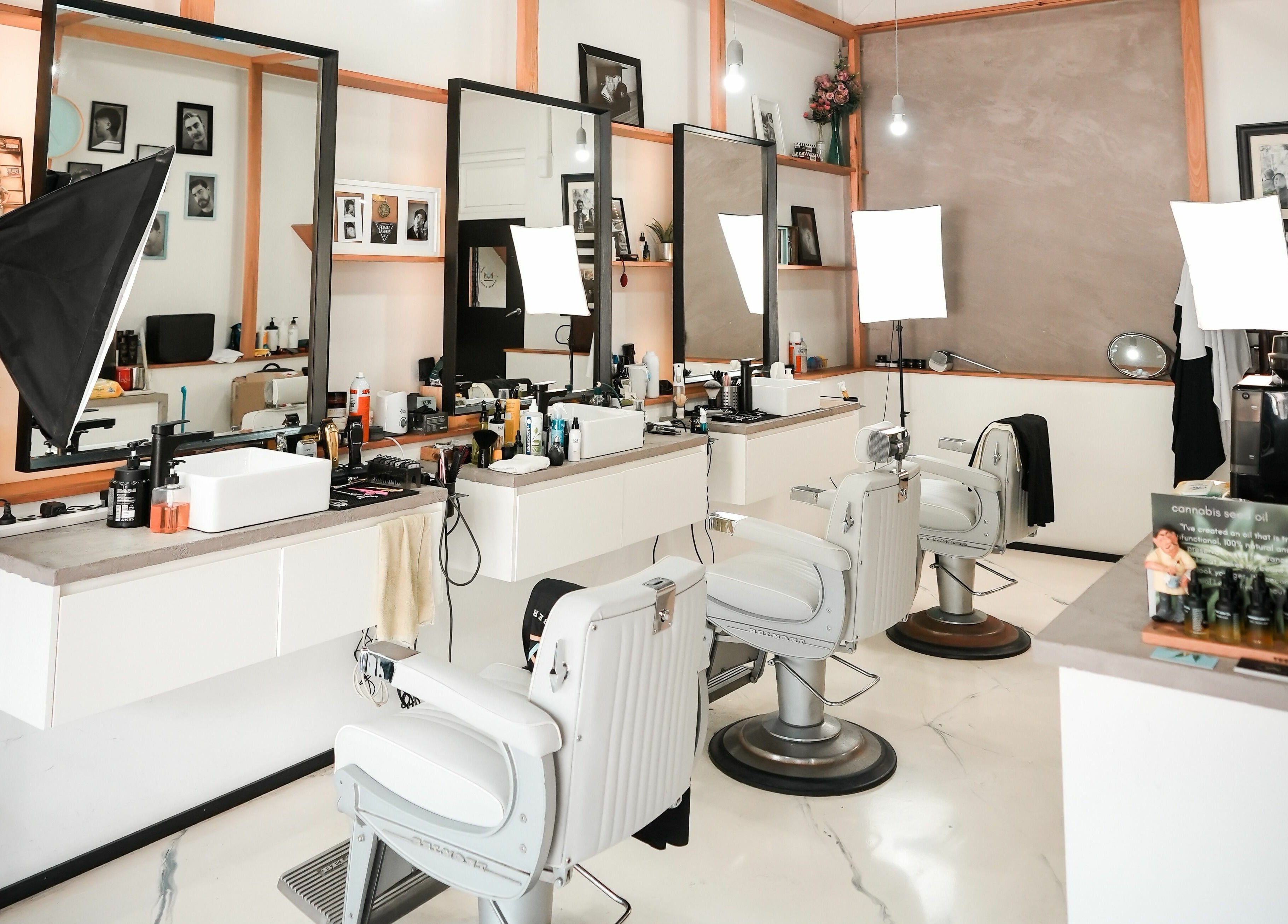 Inside Caulfield North - Another Man Barber and Shop, Melbourne, Victoria, AU. Modern barber chairs and sleek decor.