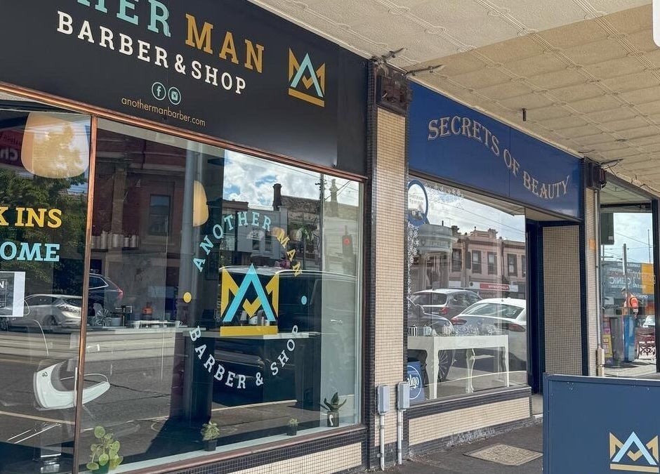 Exterior of Kew - Another Man Barber & Shop in Melbourne, Victoria, AU showcasing stylish facade and street view.