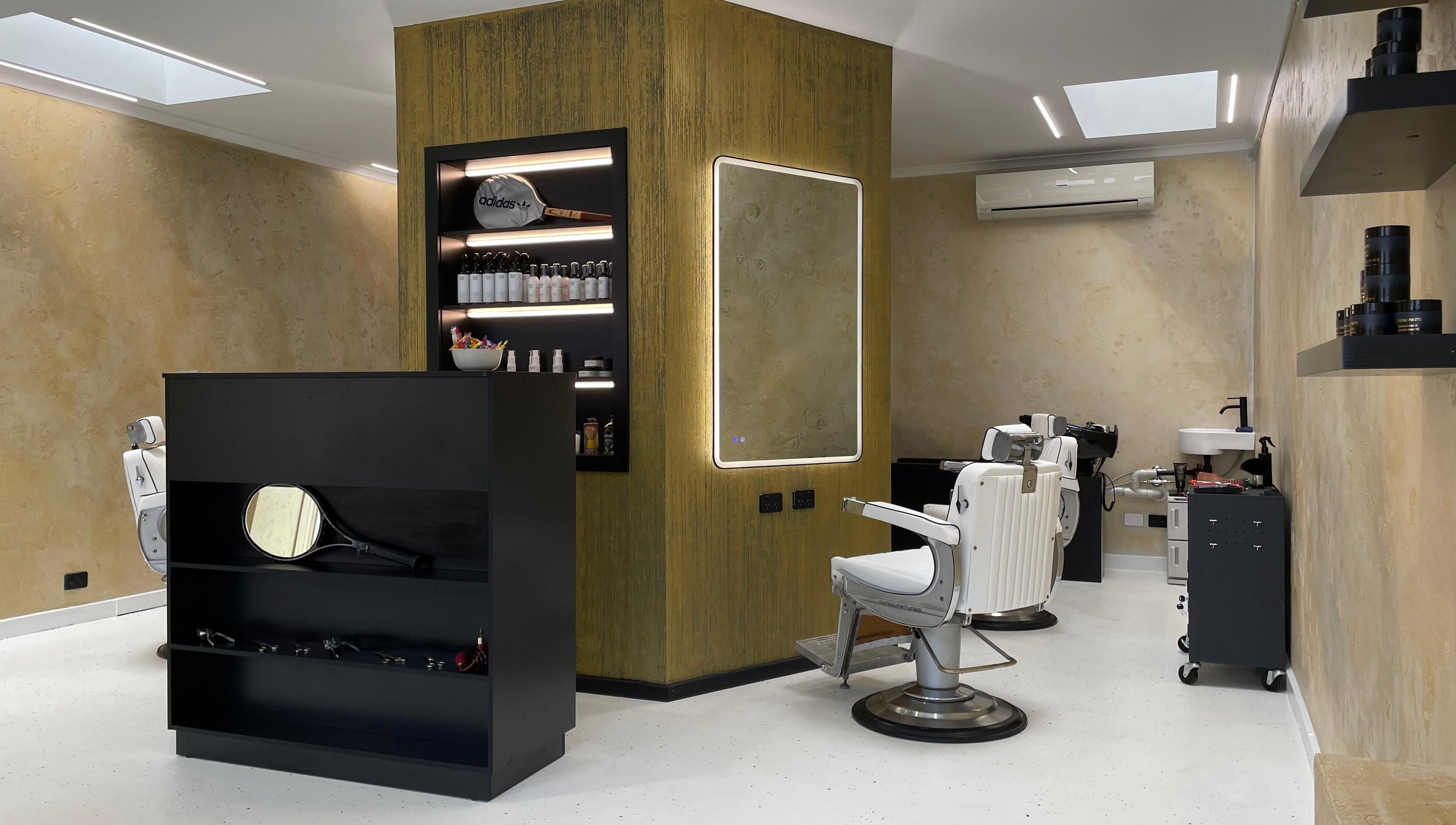 Interior of Ripponlea - Another Man Barber & Shop in Melbourne, Victoria, AU showcasing stylish barber chairs and products.