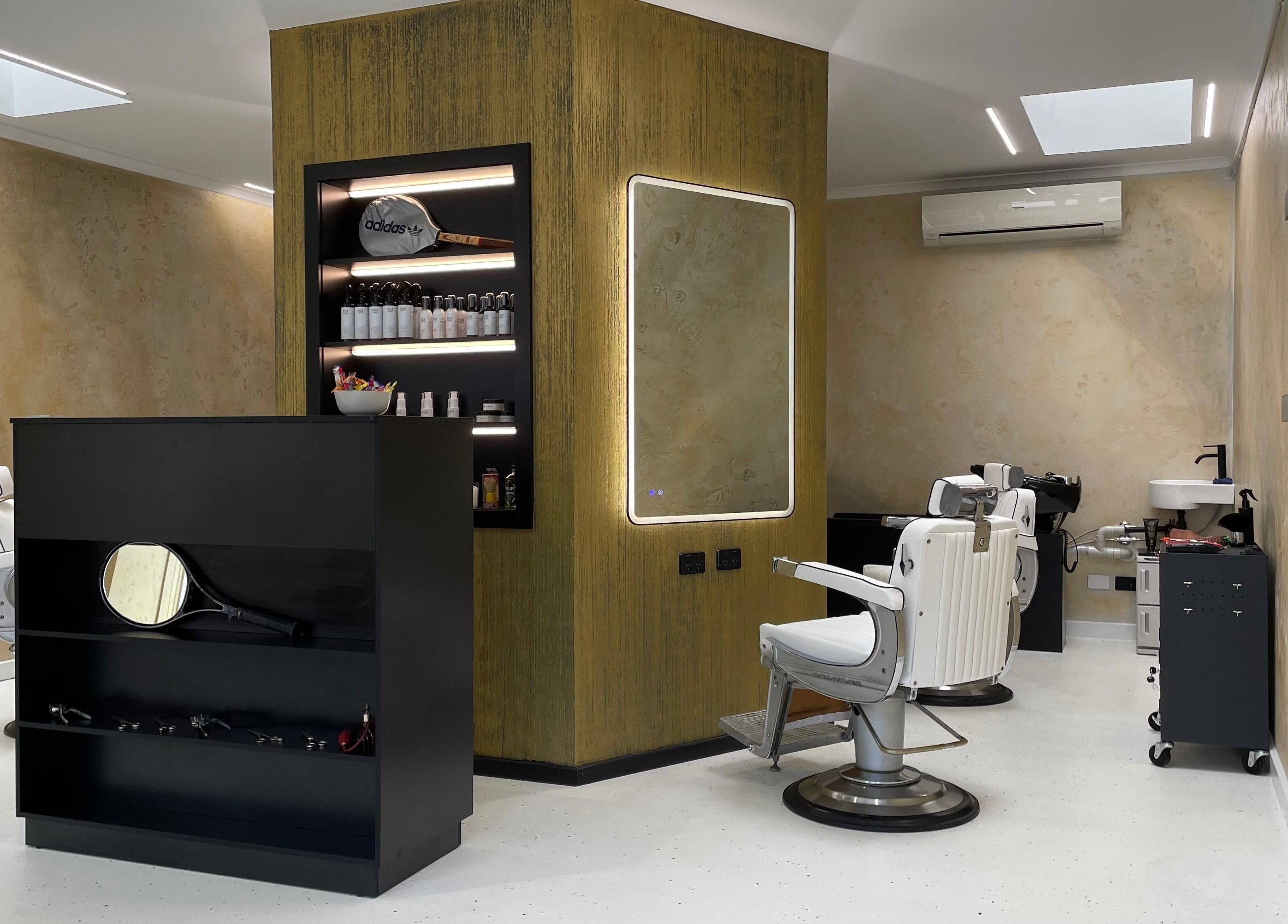 Interior of Ripponlea - Another Man Barber & Shop in Melbourne, Victoria, AU showcasing stylish barber chairs and products.