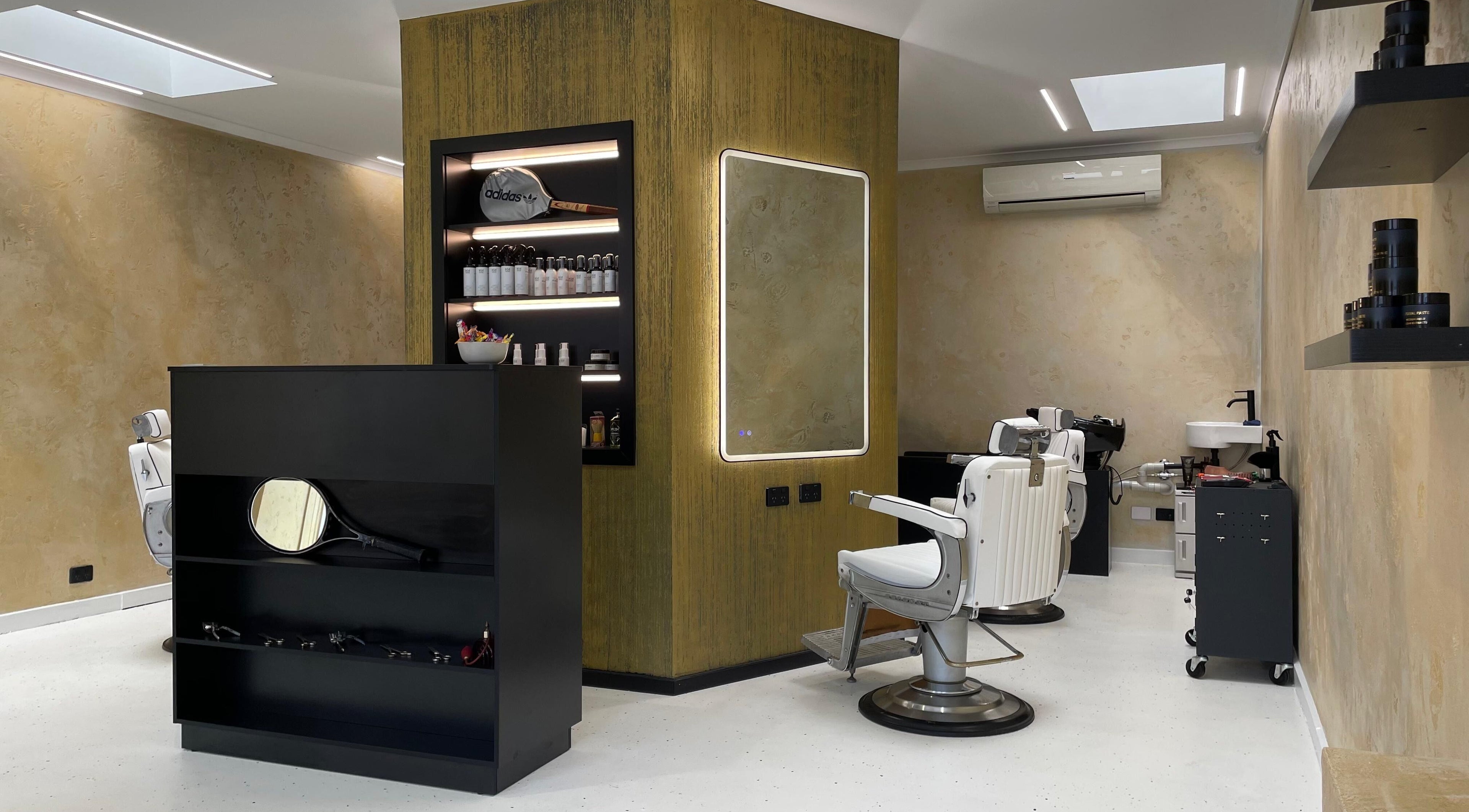 Interior of Ripponlea - Another Man Barber & Shop in Melbourne, Victoria, AU showcasing stylish barber chairs and products.