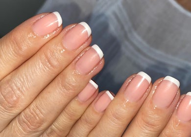 Elegant French manicure at The Beauty Room by Victoria, Chelmsford, England, GB, showcasing classic nail style.