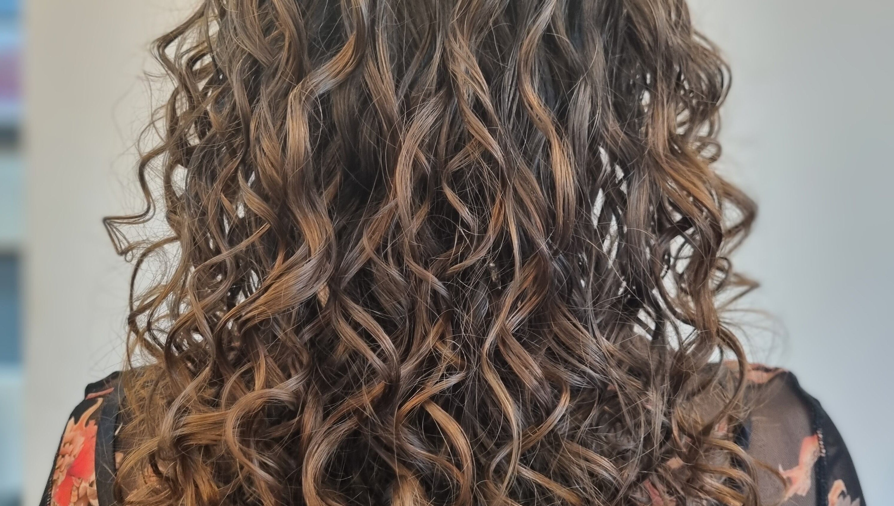Beautiful curly hairstyle at Kay's Tresses, Birmingham, England, GB, showcasing stunning texture and volume.