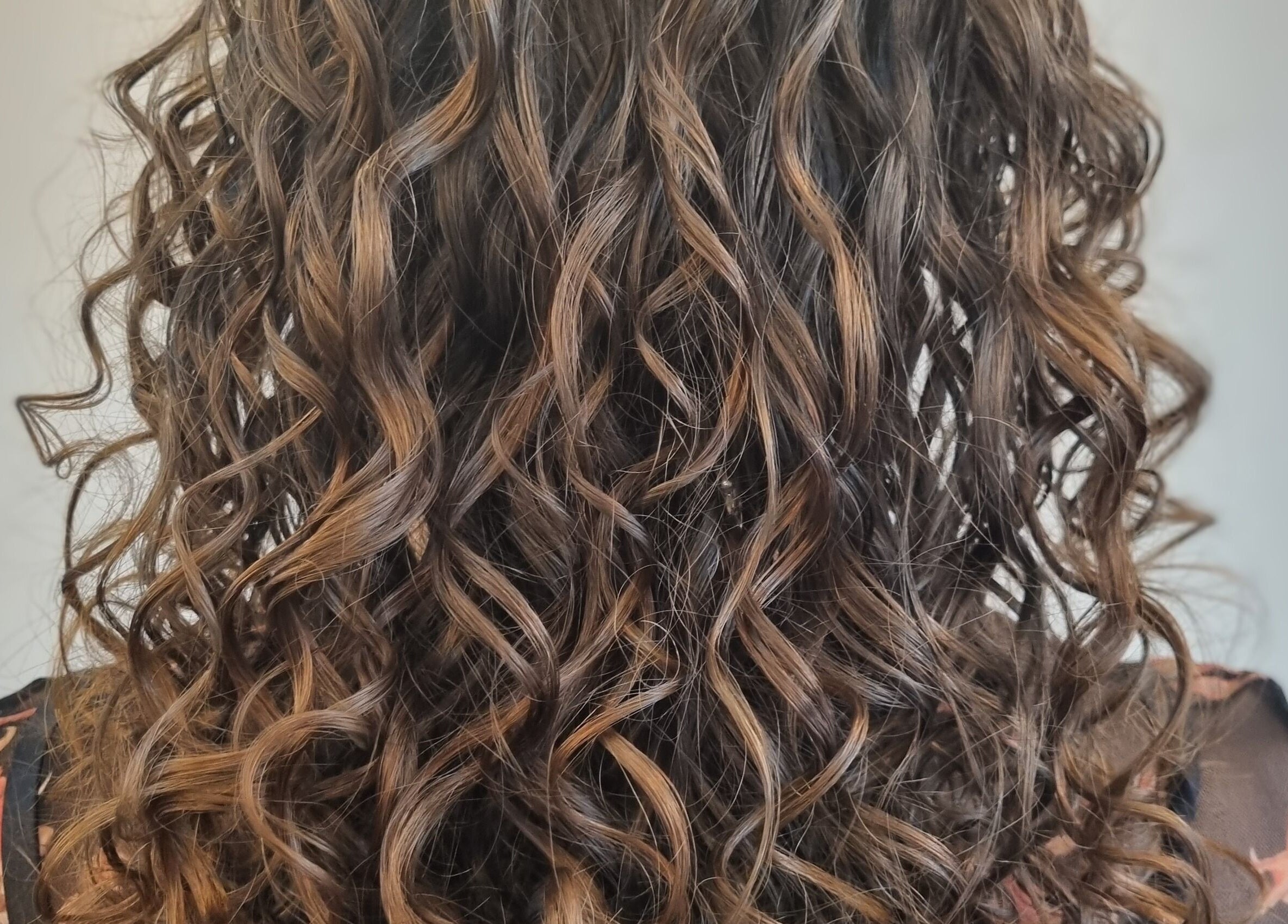 Beautiful curly hairstyle at Kay's Tresses, Birmingham, England, GB, showcasing stunning texture and volume.