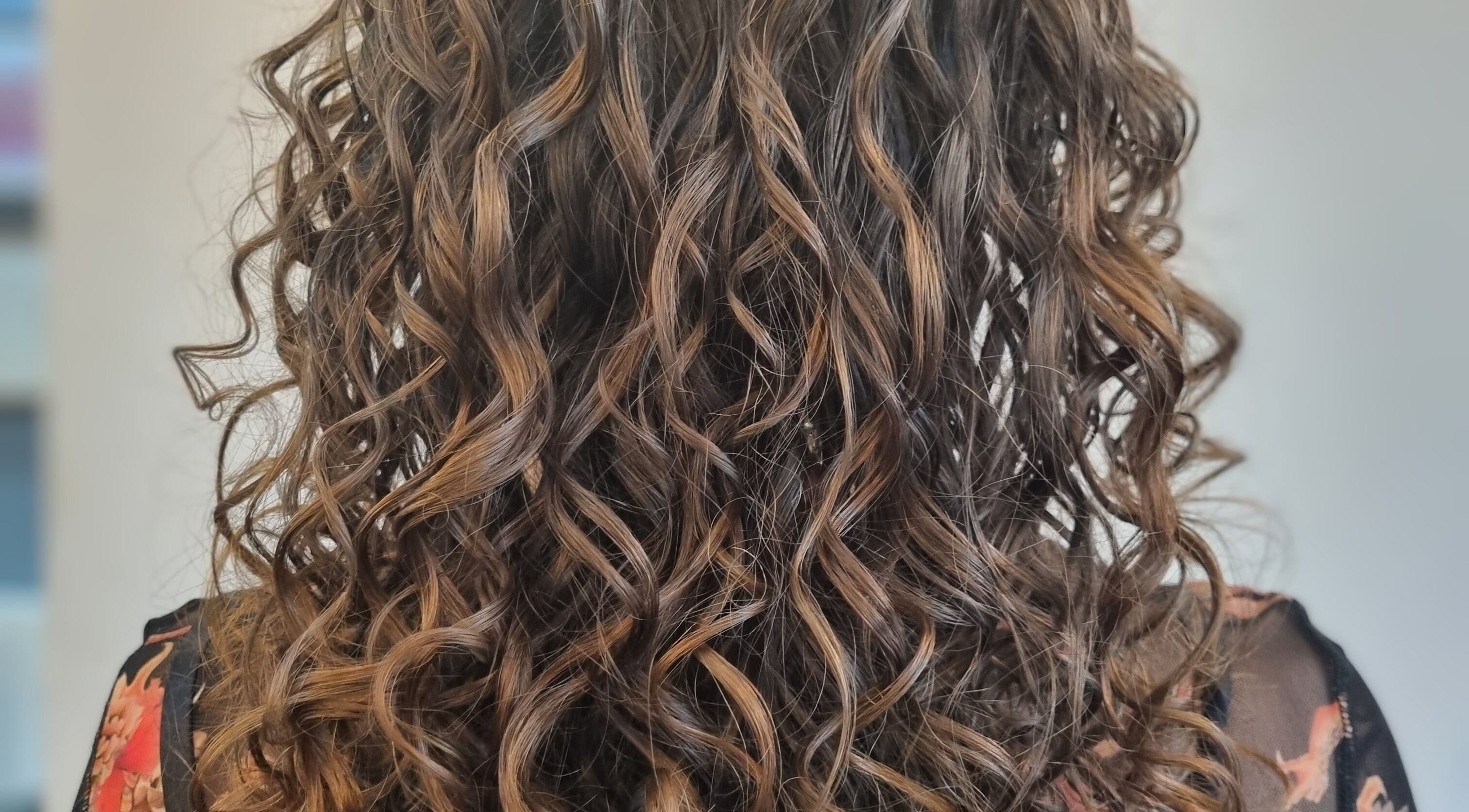 Beautiful curly hairstyle at Kay's Tresses, Birmingham, England, GB, showcasing stunning texture and volume.