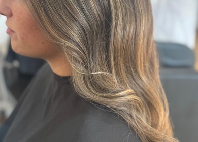 Stylish wavy hairstyle at Afterglow at 102, Fareham, England, GB. Ideal for a chic look.