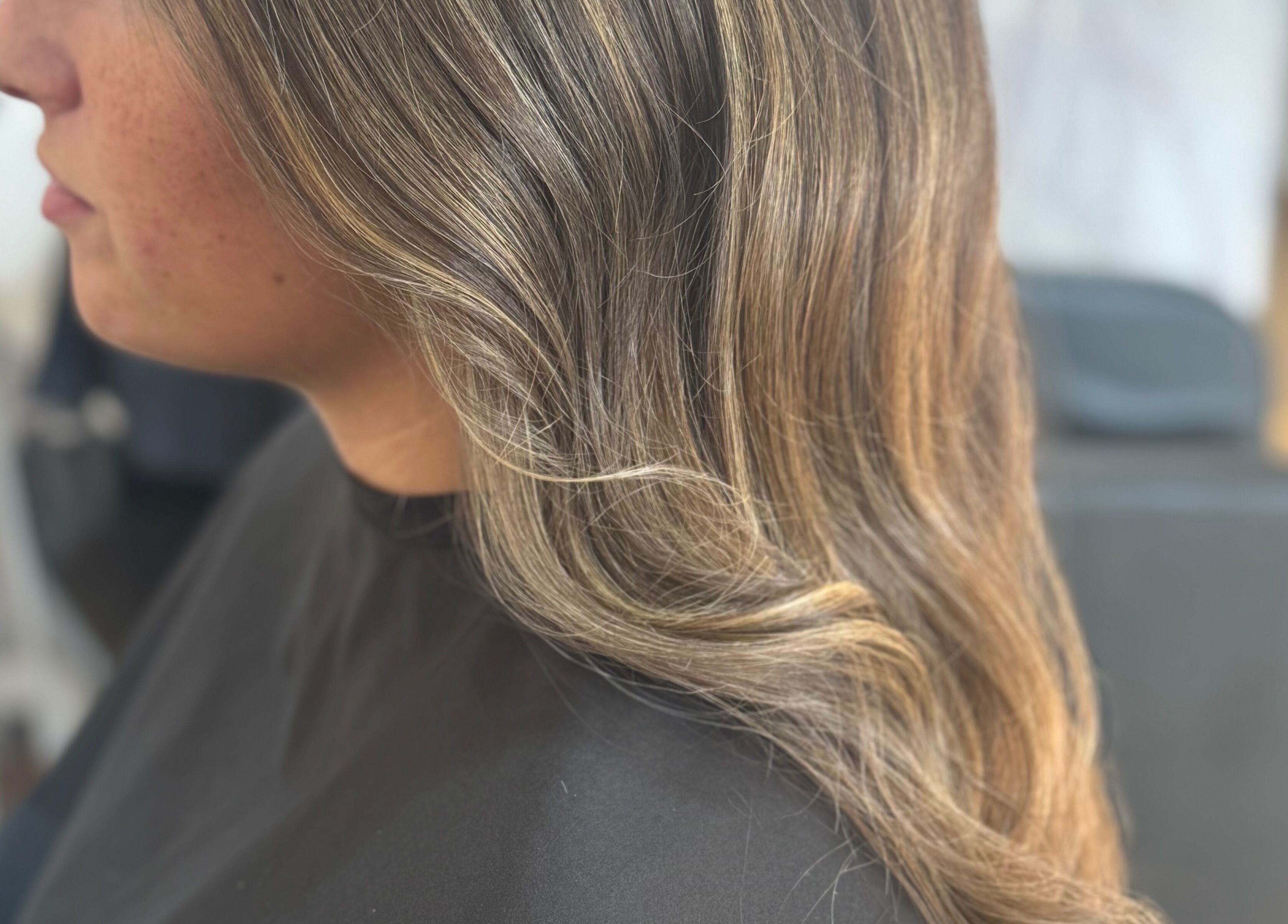 Stylish wavy hairstyle at Afterglow at 102, Fareham, England, GB. Ideal for a chic look.