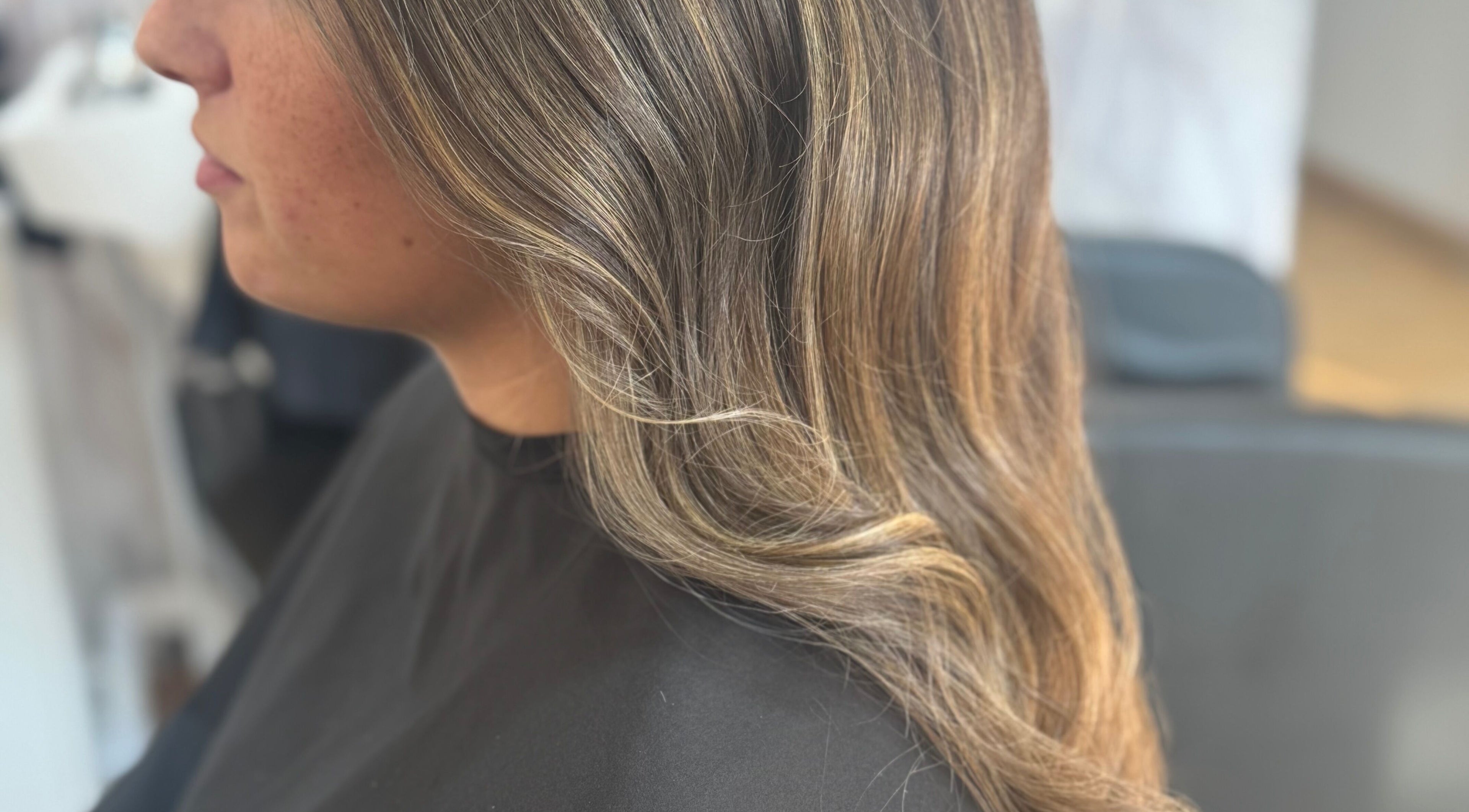 Stylish wavy hairstyle at Afterglow at 102, Fareham, England, GB. Ideal for a chic look.