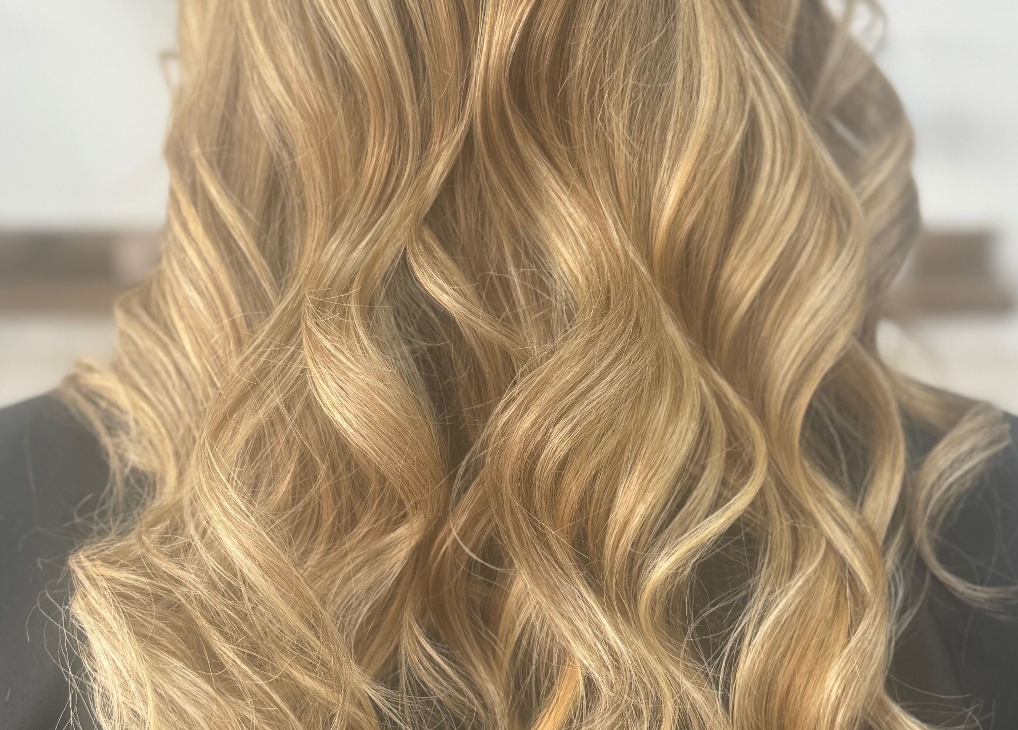 Elegant blonde waves styled at Afterglow at 102, Fareham, England, GB for a polished look.