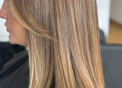 Sleek blonde hair styled at Afterglow at 102, Fareham, England, GB.