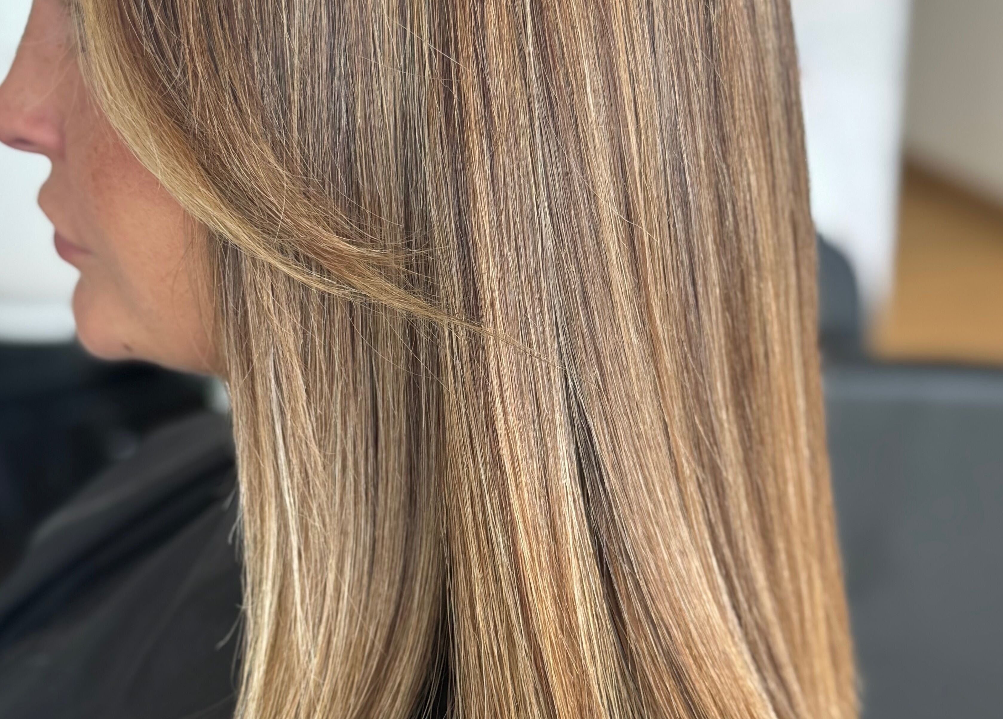 Sleek blonde hair styled at Afterglow at 102, Fareham, England, GB.