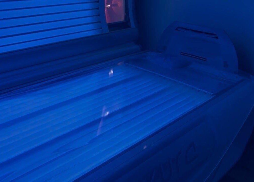 Tanning bed at Afterglow at 102 in Fareham, England, GB offering a relaxing blue-lit ambiance.
