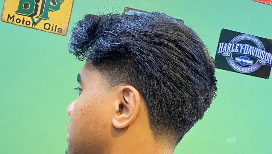 Close-up of a trendy men's haircut at THE CUTZS, Machang, Kelantan, MY, featuring a sleek fade.