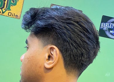 Close-up of a trendy men's haircut at THE CUTZS, Machang, Kelantan, MY, featuring a sleek fade.