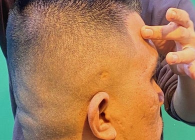 Close-up of a precise haircut at THE CUTZS, Machang, Kelantan, MY, showcasing expert grooming skills.