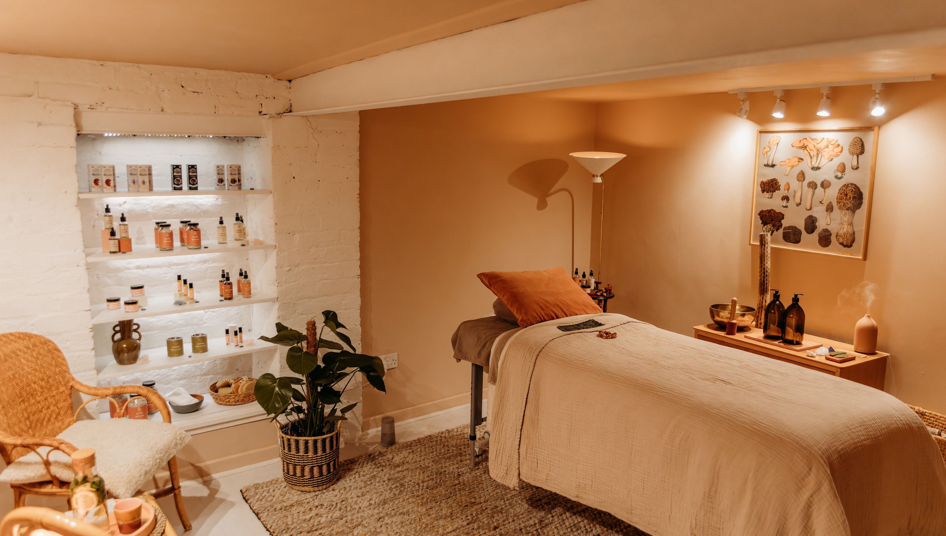 Relaxing treatment room at Hansen Botanics in Shrewsbury, England, GB with cozy decor and wellness products.