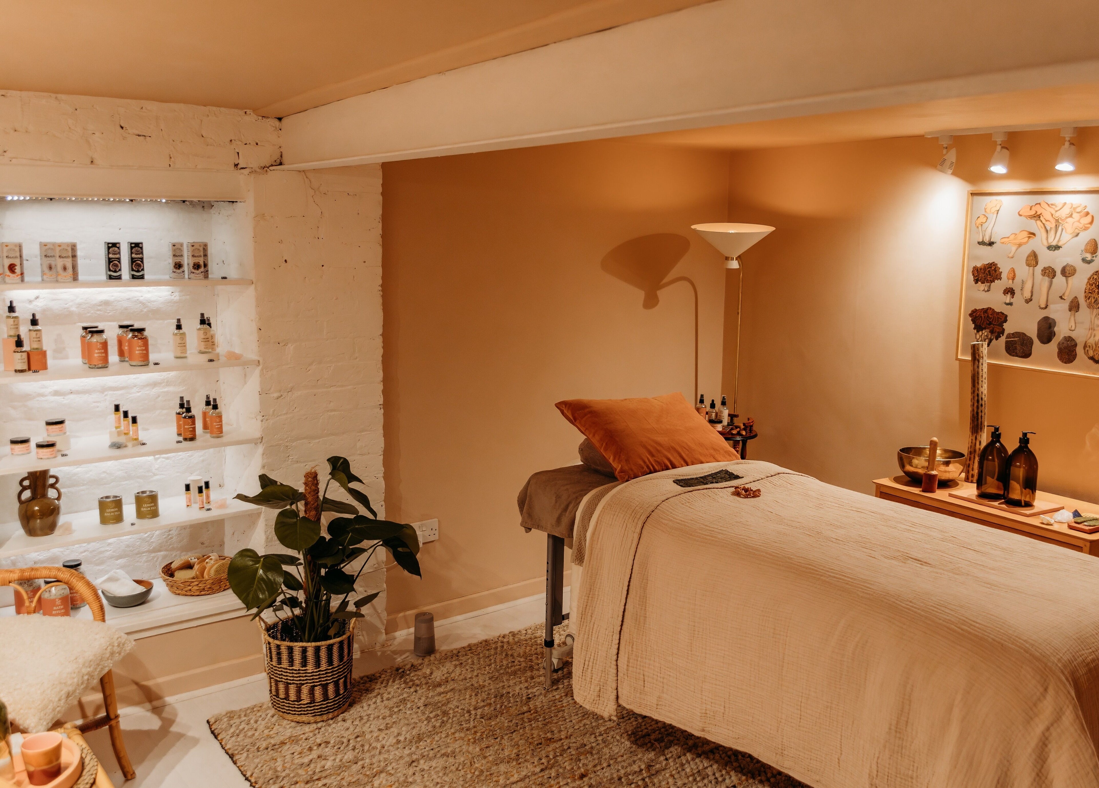 Relaxing treatment room at Hansen Botanics in Shrewsbury, England, GB with cozy decor and wellness products.