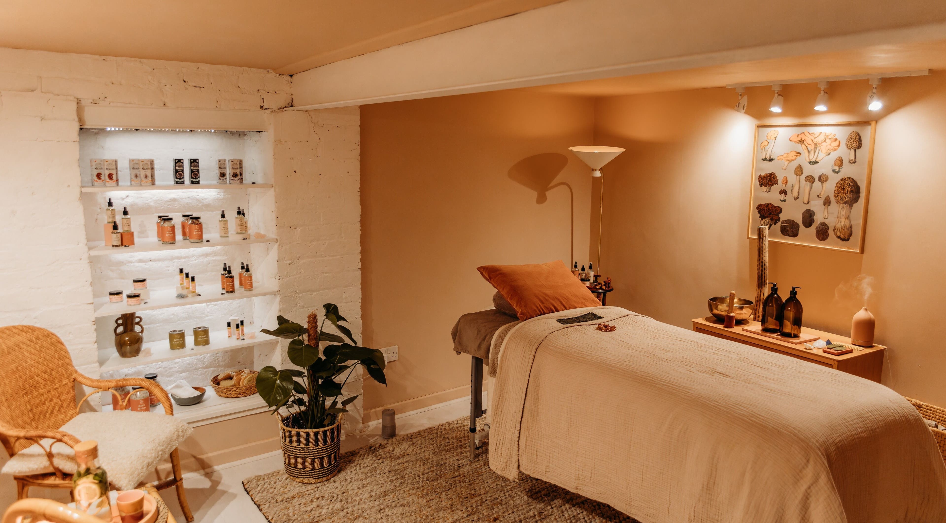 Relaxing treatment room at Hansen Botanics in Shrewsbury, England, GB with cozy decor and wellness products.