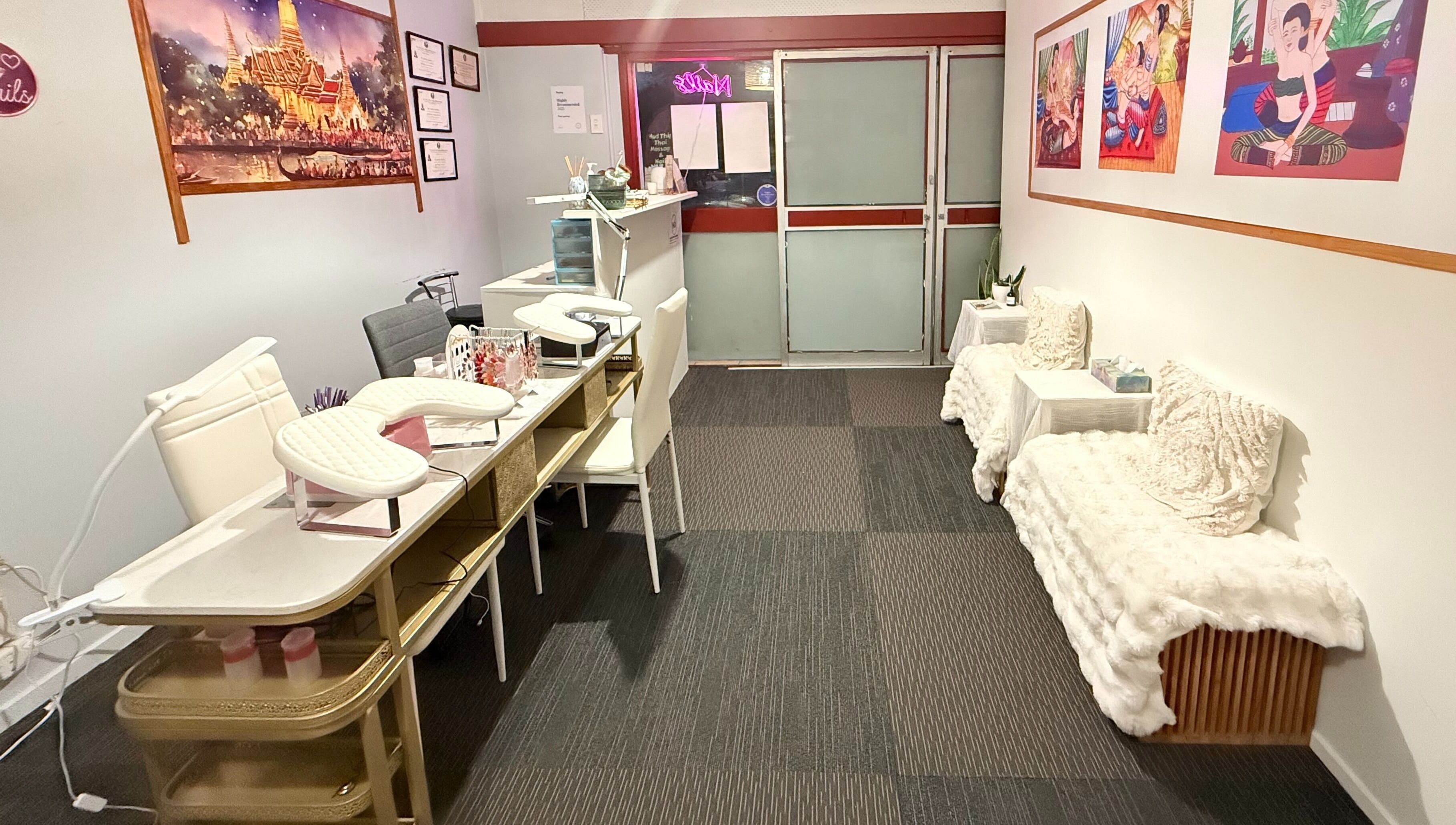Interior of Hudthip Thai Massage & Nail Art in Auckland, Auckland, NZ, showcasing elegant nail stations and cozy seating.