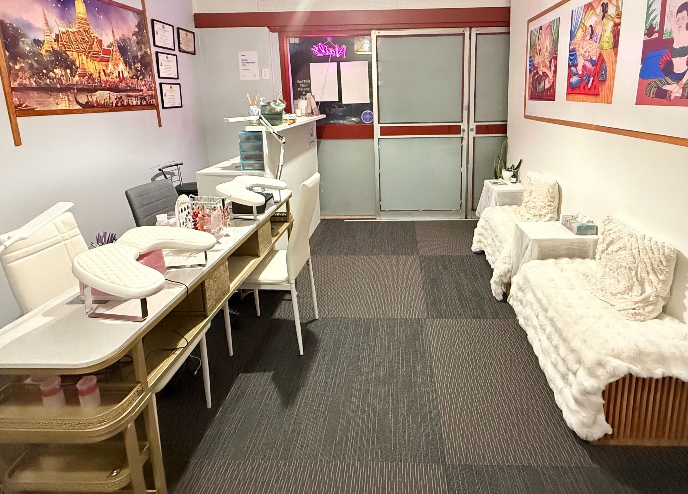 Interior of Hudthip Thai Massage & Nail Art in Auckland, Auckland, NZ, showcasing elegant nail stations and cozy seating.