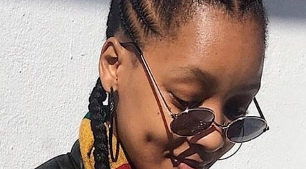 Close-up of braids and sunglasses at Nubian Crown Hyde Park, Sandton, Gauteng, ZA.