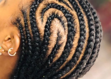 Intricate braided hairstyle at Nubian Crown Hyde Park, Sandton, Gauteng, ZA, showcasing detailed craftsmanship.