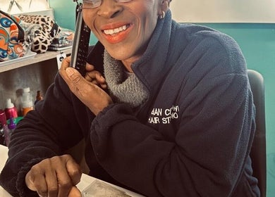 Friendly staff member at Nubian Crown Hyde Park in Sandton, Gauteng, ZA, offering warm customer service over the phone.