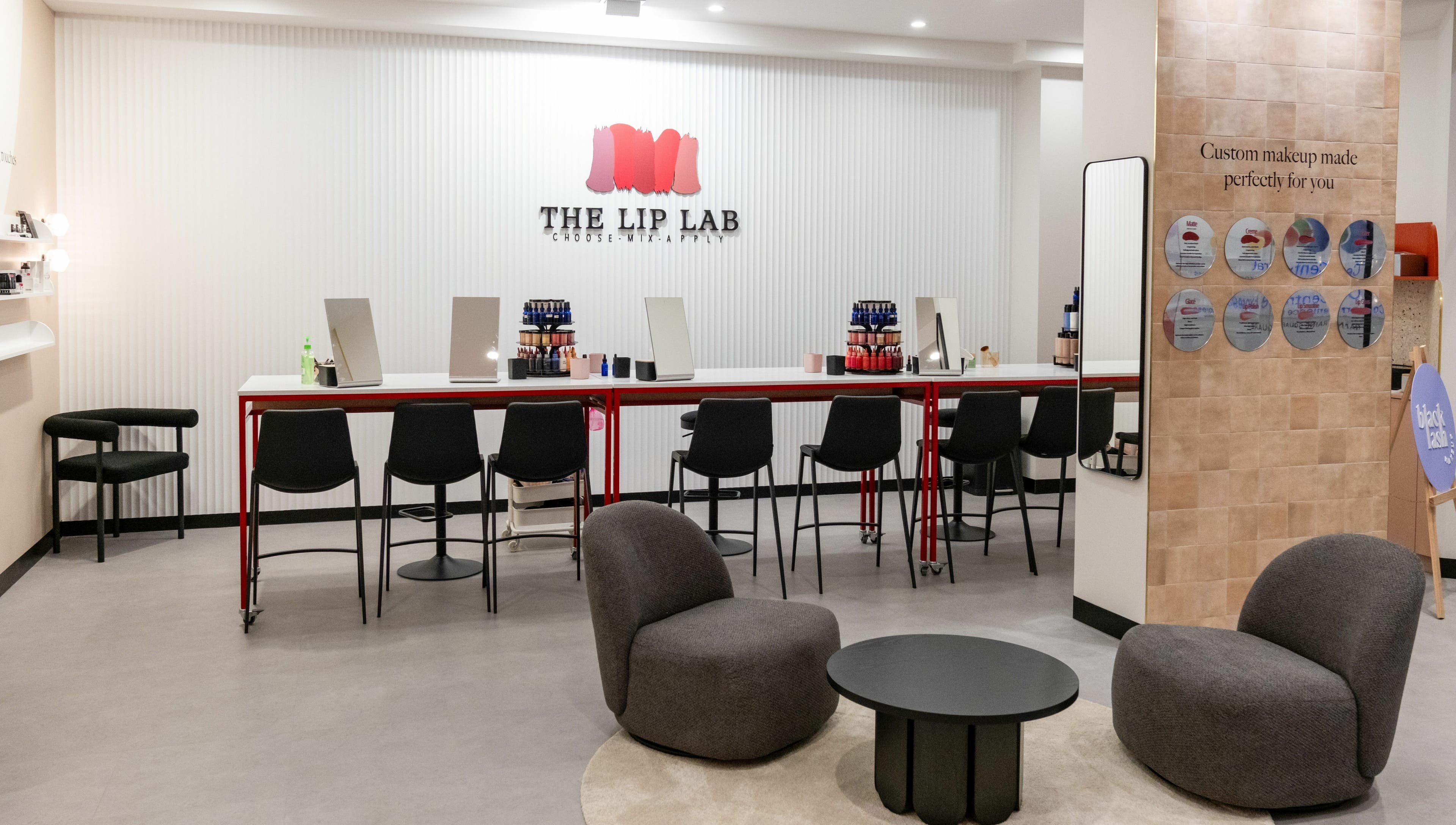 Stylish interior of The Lip Lab in Perth, Western Australia, AU with makeup stations and plush seating.