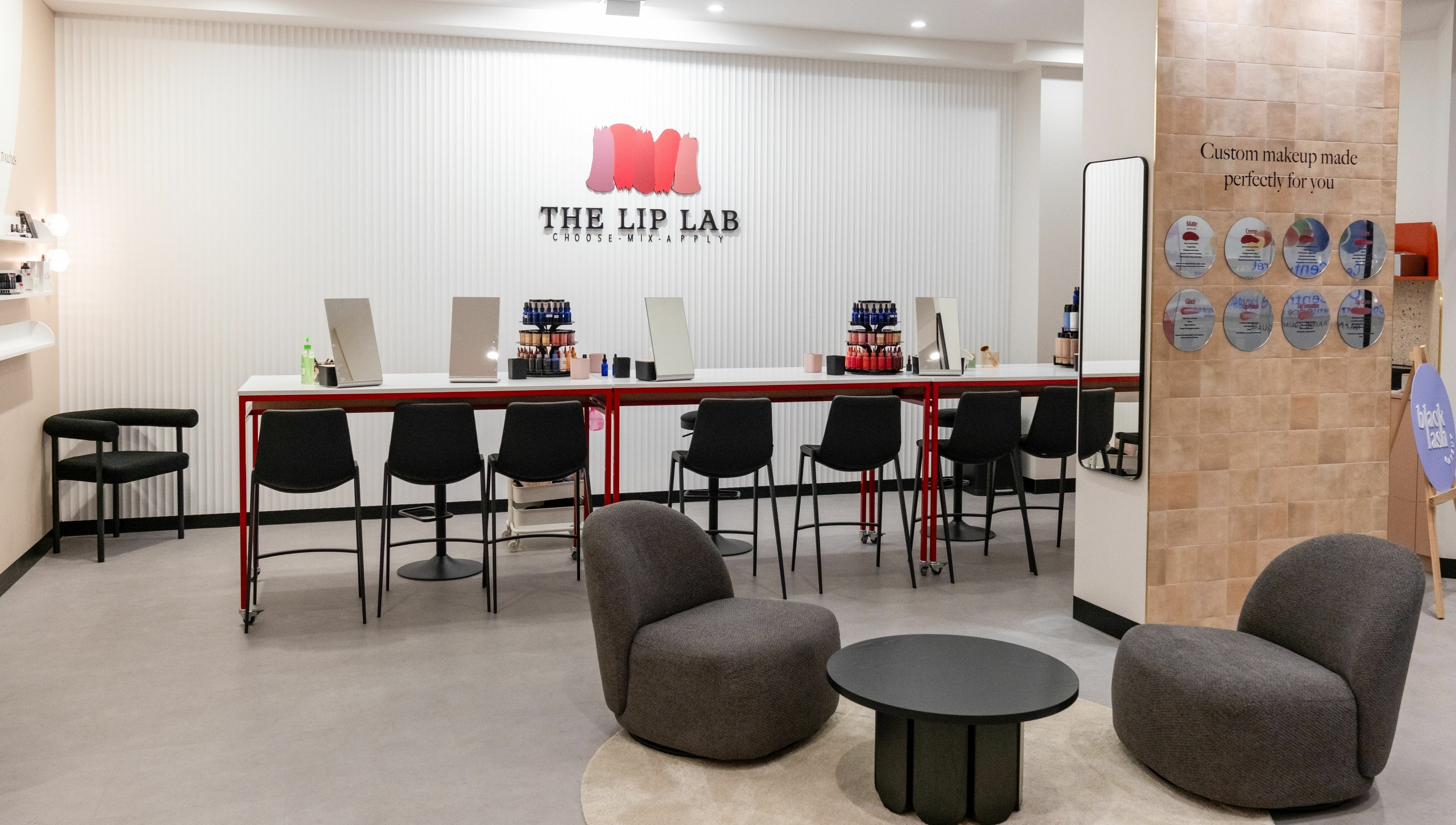 Stylish interior of The Lip Lab in Perth, Western Australia, AU with makeup stations and plush seating.