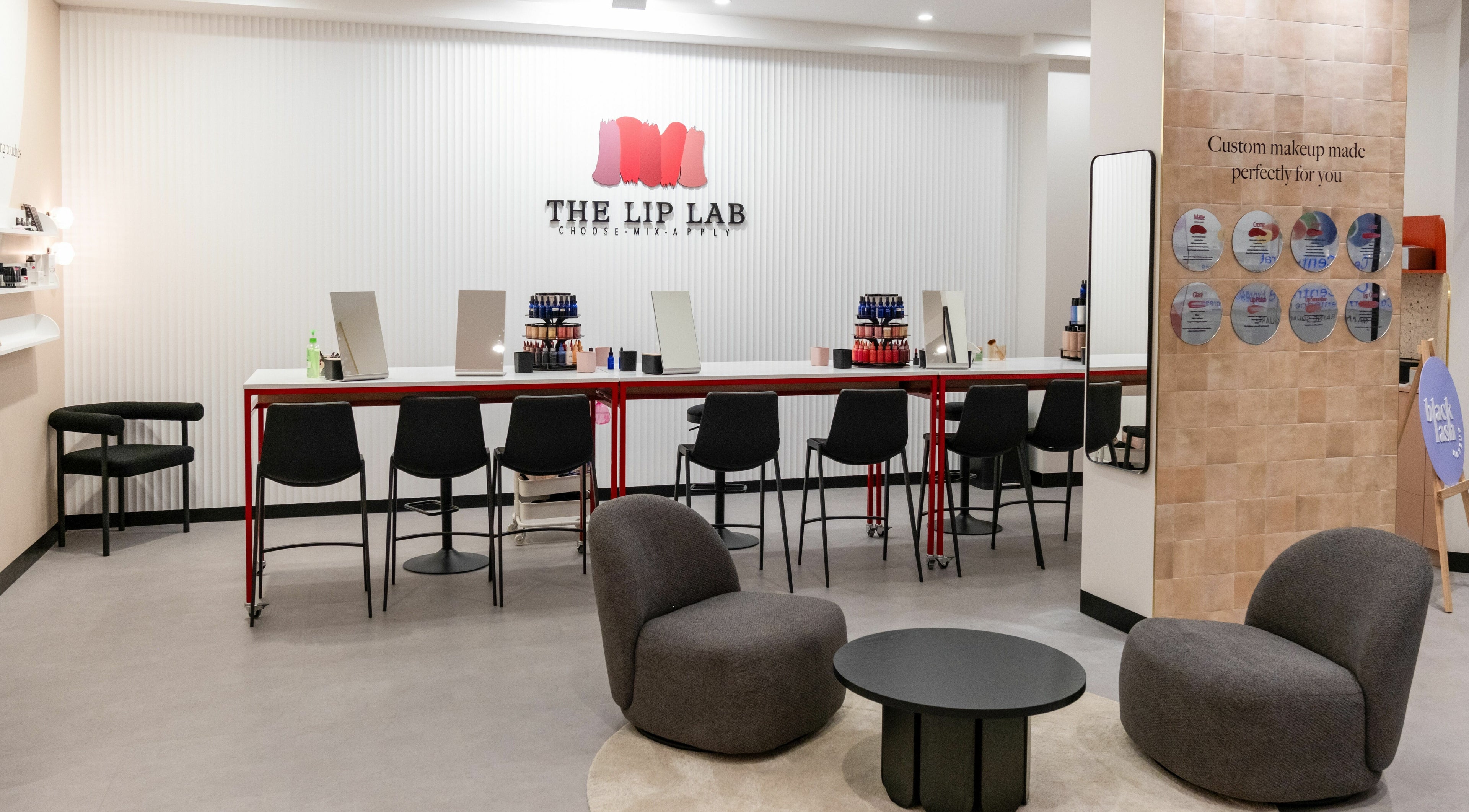 Stylish interior of The Lip Lab in Perth, Western Australia, AU with makeup stations and plush seating.