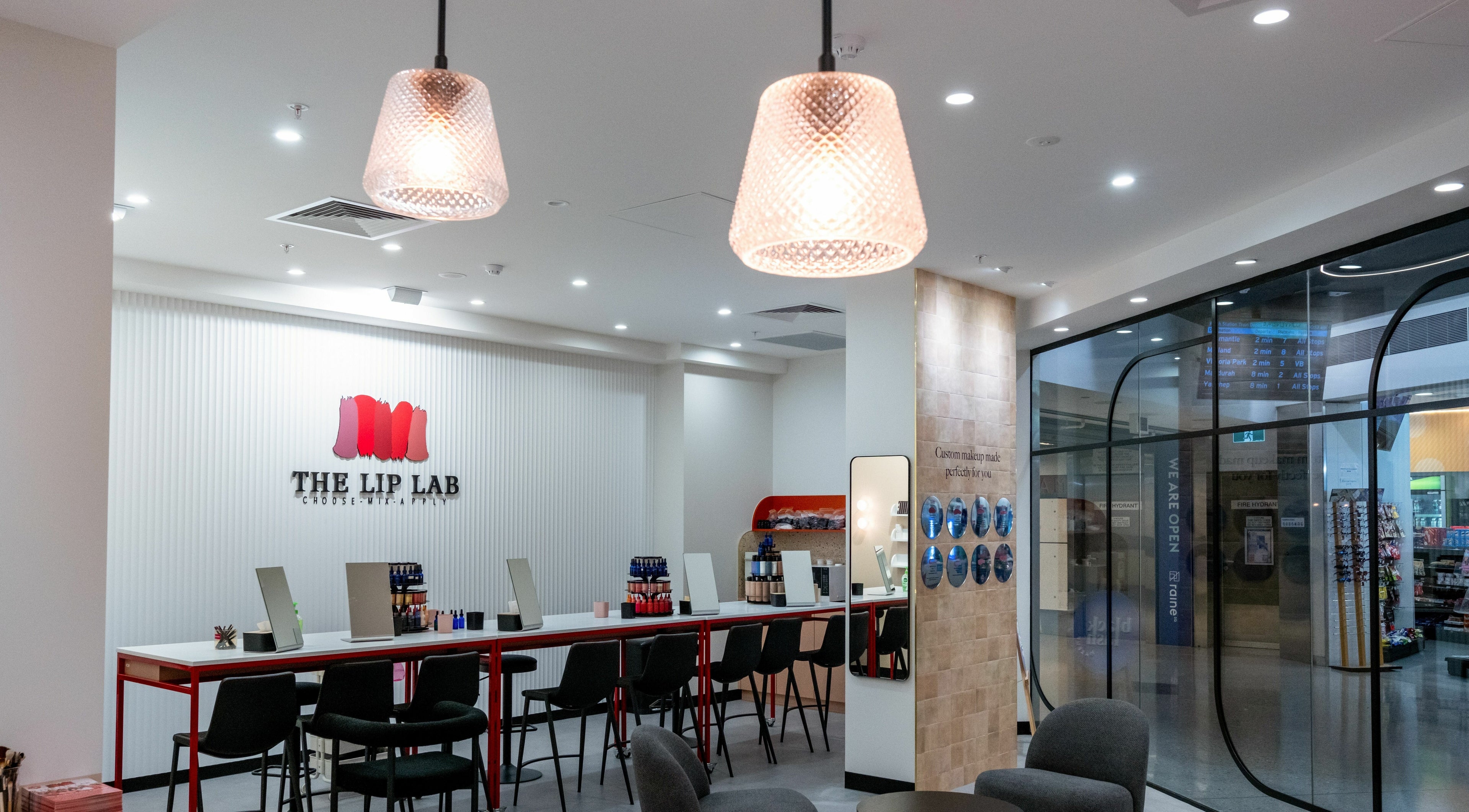 Interior of The Lip Lab in Perth, Western Australia, AU showcasing stylish seating and makeup stations.