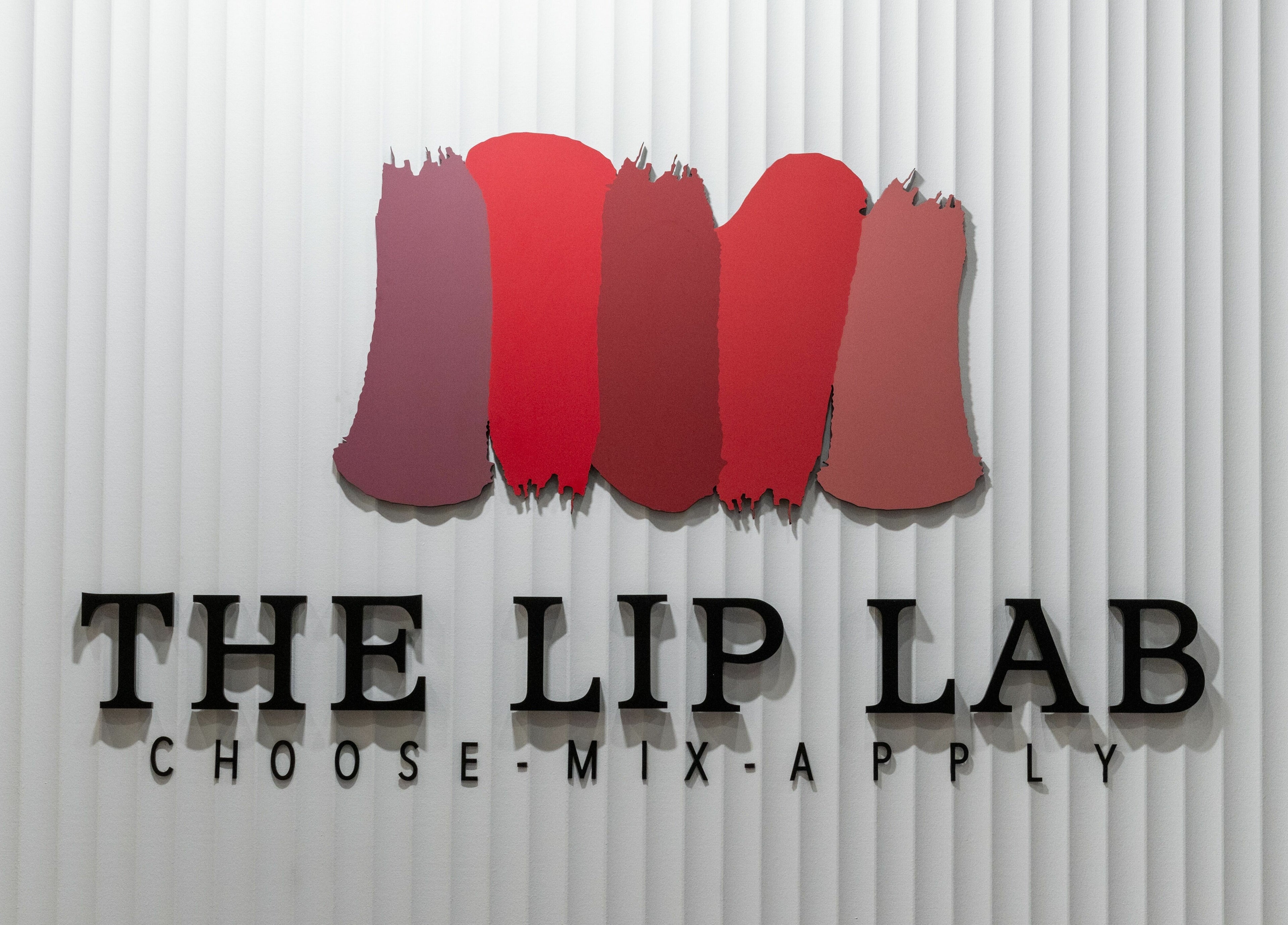 The Lip Lab logo with red smudges on a white wall in Perth, Western Australia, AU.