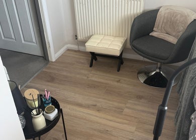 Relaxing corner at Beautybymill, Saltney Ferry, Wales, GB with chair and decor.