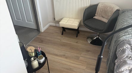 Relaxing corner at Beautybymill, Saltney Ferry, Wales, GB with chair and decor.