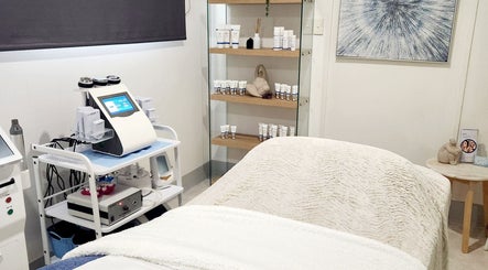 Treatment room at Youthful Glow Skin and Body Clinic, Mountain Creek, Queensland, AU with modern skincare equipment.
