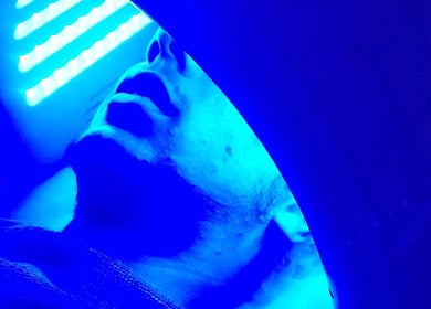Blue light therapy session at Youthful Glow Skin and Body Clinic, Mountain Creek, Queensland, AU.