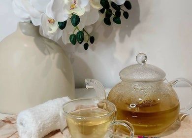 Relaxing tea setup at Youthful Glow Skin and Body Clinic, Mountain Creek, Queensland, AU with flowers.
