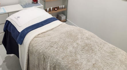 Inviting treatment bed at Youthful Glow Skin & Body Clinic in Mountain Creek, Queensland, AU.