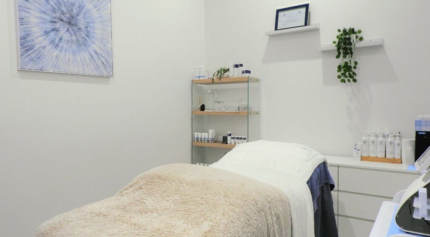 Cozy treatment room at Youthful Glow Skin & Body Clinic, Mountain Creek, Queensland, AU, with skincare products.