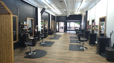 Chic interior of Beauty Revival salon in Ashland, Ohio, US with stylish hair stations and vibrant decor.