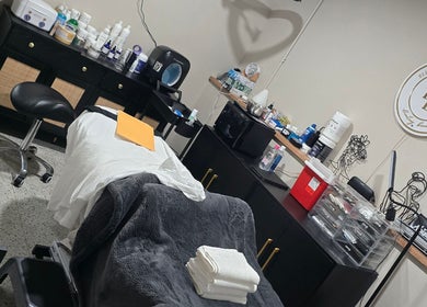 Beauty Revival's serene treatment room in Ashland, Ohio, US, featuring a spa bed and elegant decor.