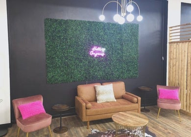Stylish lounge area at Beauty Revival in Ashland, Ohio, US with cozy seating and ambient decor.