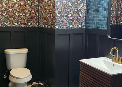 Chic bathroom at Beauty Revival, Ashland, Ohio, US with floral wallpaper and modern fixtures.