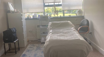Relaxing treatment room at Glamour Beauty Concept, Bray, County Wicklow, IE, with a massage bed and essentials.