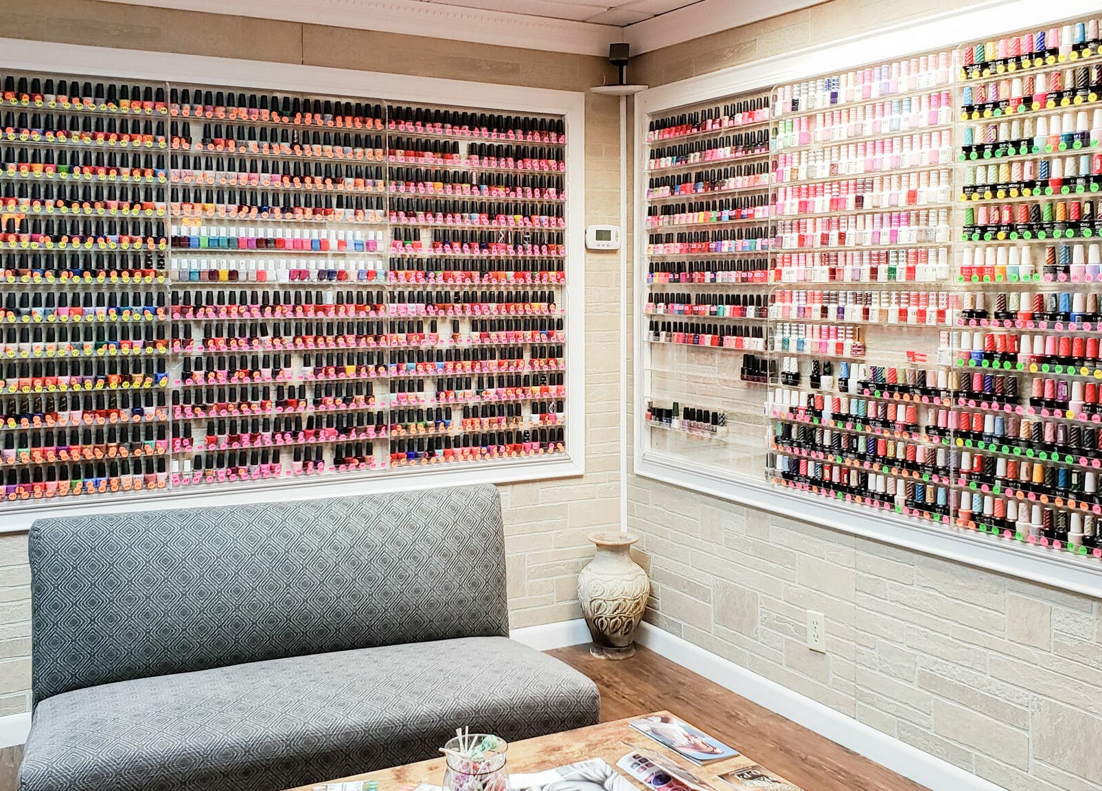 Extensive nail polish display at Quality Nails Spa, Hingham, Massachusetts, US, showcasing vibrant color options.