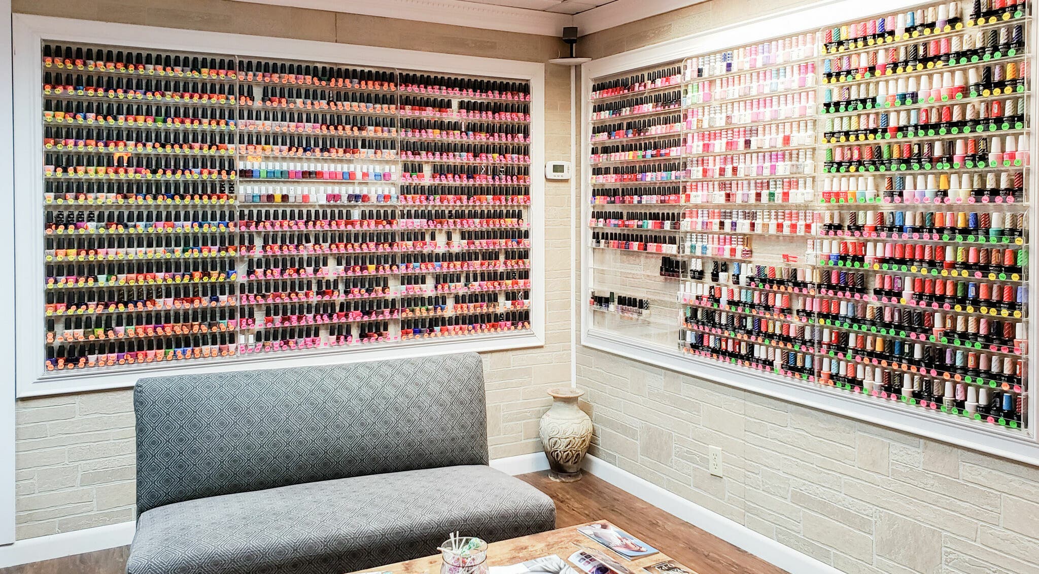Extensive nail polish display at Quality Nails Spa, Hingham, Massachusetts, US, showcasing vibrant color options.
