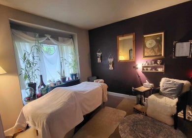 Cozy massage room at Massage with Liz, LLC in Springfield, Oregon, US, featuring a soothing ambiance with soft lighting.