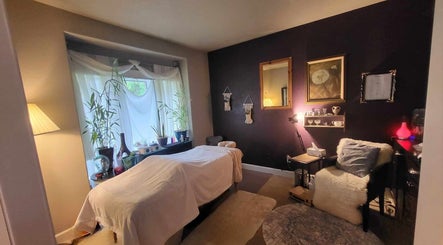 Cozy massage room at Massage with Liz, LLC in Springfield, Oregon, US, featuring a soothing ambiance with soft lighting.