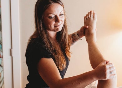Therapist performing leg massage at Massage with Liz, LLC in Springfield, Oregon, US.